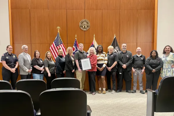 Lucas County 911 RCOG Management, Telecommunicators, and Union Leadership pause for a photo with the Lucas County Commissioners.